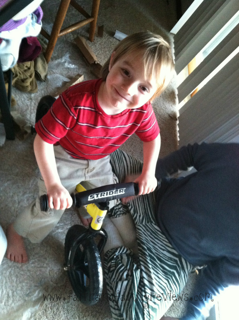 Strider Bike makes boy very happyedit